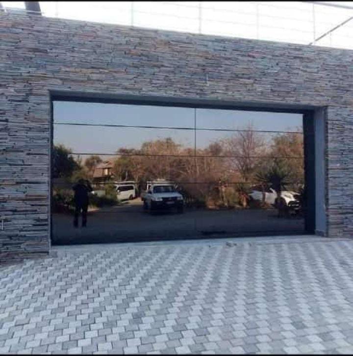 Double flush glass garage door Bryanston Sandton Trideniel