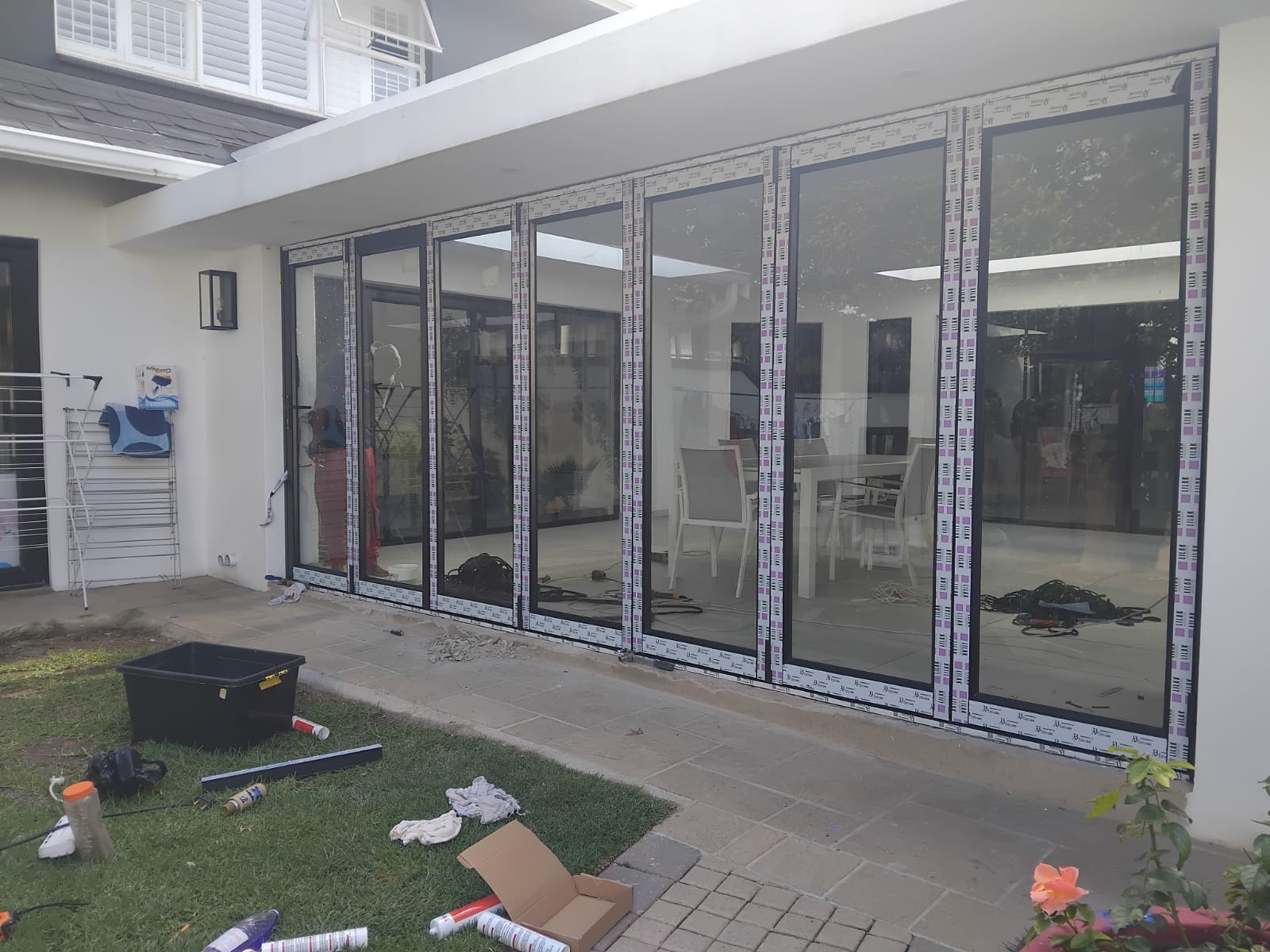 During 6-panel aluminium folding door installation — Fourways, Gauteng